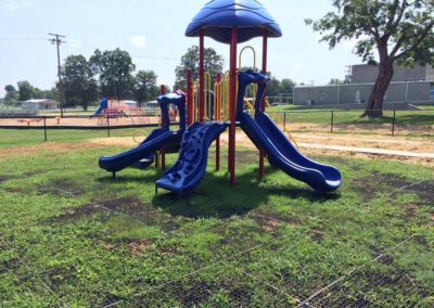 rubber grass mats underneath a playground in kentucky