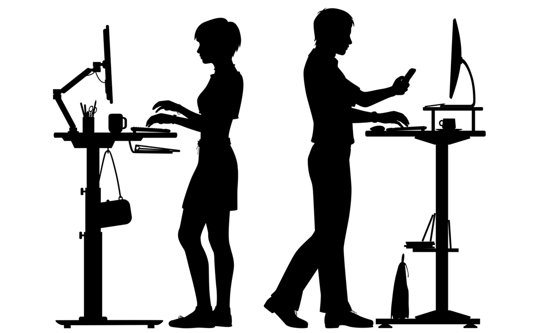 silhouette of man and woman standing at their desks