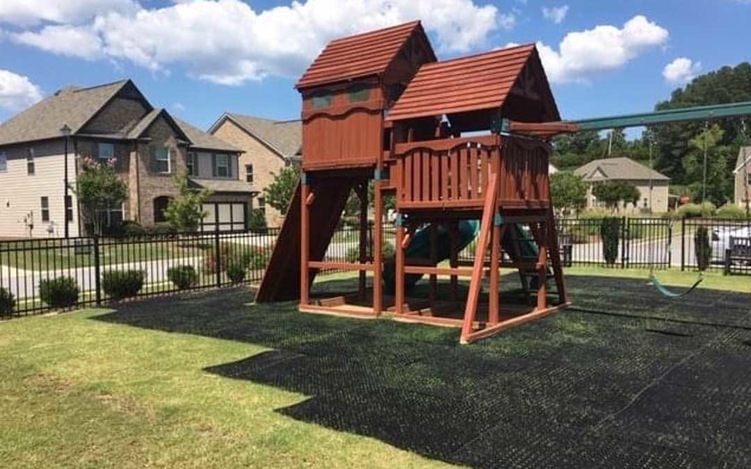 residential property with protection mesh under playset