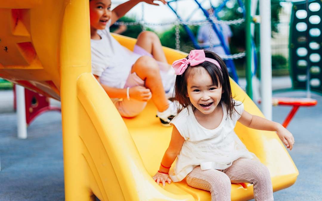 sisters playing together at daycare