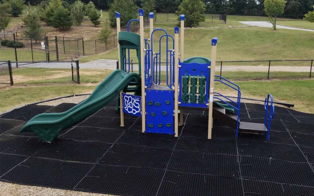 grass mats used as the primary surface under an elementary school playground