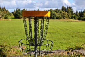 disk golf basket on a disk golf course